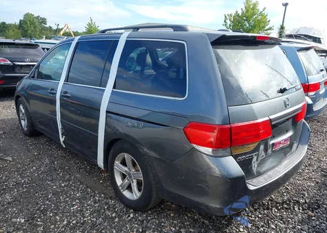 2010 Honda Odyssey Ex-L z USA, uszkodzony, nr VIN 5FNRL3H70AB021452